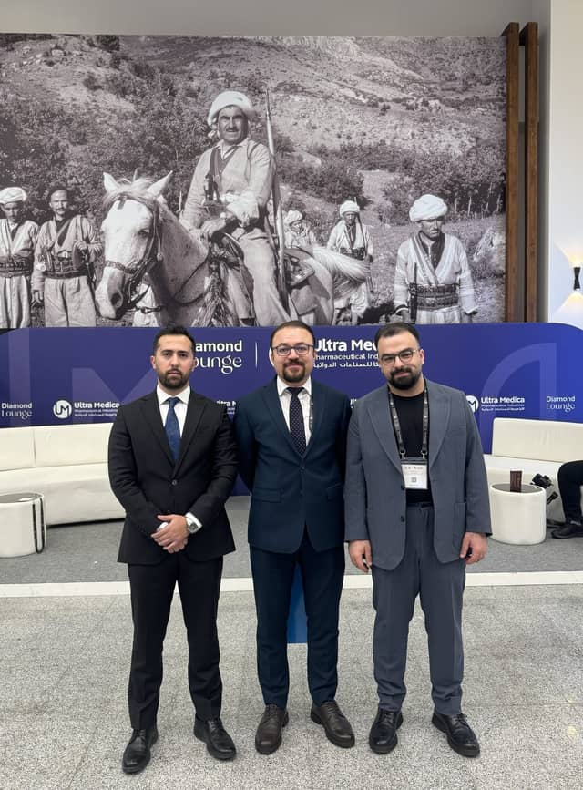 Dr. Karzan with two colleagues in the Diamond Lounge