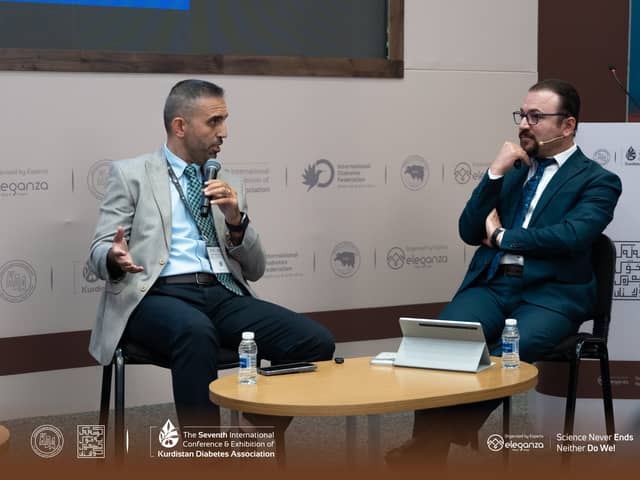 Dr. Karzan listening as a fellow panellist speaks